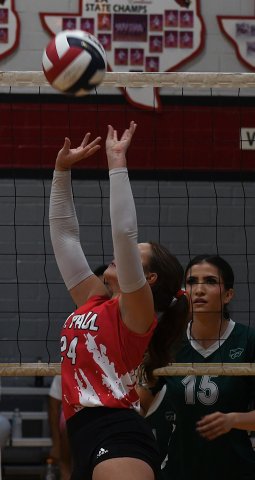 Reese Patek sets the ball  in the match against Houston School of Woods on Sept. 15. Photo by Mark Lube. 