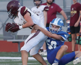 Photo by Chuck Grafe Tatum Beach tackles Milano’s Dylan Magee.