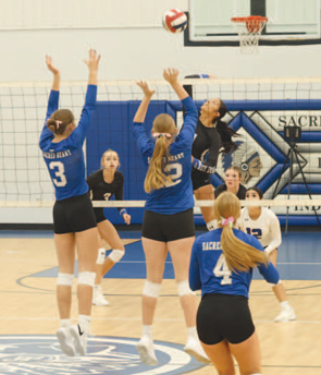 Photo by Chuck Grafe Layne Besetzny (3) and Ashtyn Schaefer (12) on the defense against Yoakum.