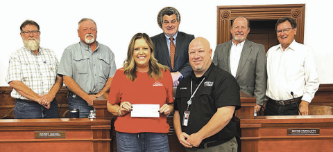 During Monday’s Lavaca County Commissioners’ Court meeting, EOG Resources presented a check for $15,000 to the Lavaca County  Office of Emergency Management. Front from left EOG Resources Safety and Operations representative Chelsea Ashworth and Lavaca  County Emergency Management coordinator Greg Murrile. Back row from left are commissioners Dennis W. Kocian, Kenny Siegel, County  Judge Keith Mudd, and commissioners Wayne Faircloth and Edward Pustka. Photo by Jimmy Appelt