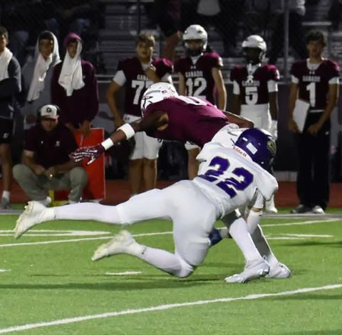 Triston Vesely wraps up Ganado receiver Zaeden Dilworth during Shiner’s 41-23 win on Friday in Ganado. Photo courtesy of Louann Heinsohn.