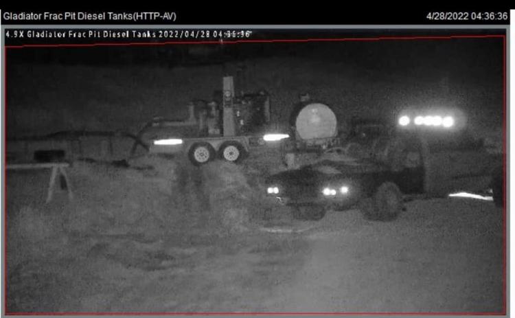 Security cameras captured images of what appears to be a light-colored Dodge cab-and-a-half flatbed pickup, with a fuel tank mounted on the bed, seen on location the day the 500-gallon fuel tank turned up missing.