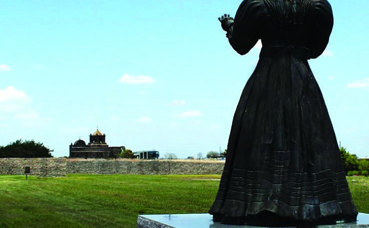 The statue of the Angel of Goliad seems to be watching over Presido la Bahia. This is where Texas soldiers were held before Gen. Santa Anna ordered them to be massacred on Palm Sunday, 1836. – Photo by Murray Montgomery