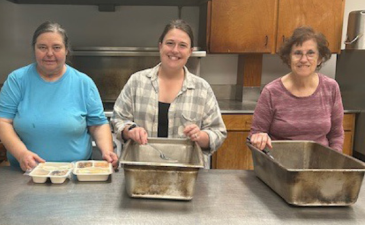 Marla Ebner, Brandy Cunning, and Delores Blaschke prepares meals for senior citizens.