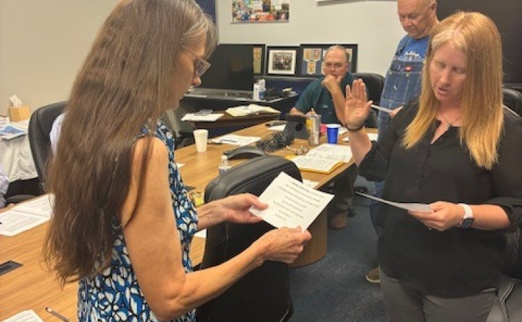 The Yoakum ISD Board administered the Oath of Office to board member Amanda Fling for a three-year term. At left is Paula Janota.
