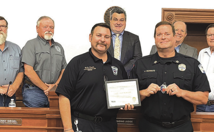 County EMS Captain John Schultz was recognized and presented an accommodation for assisting the Fayette County EMS with an incident last week. The presentation took place at Monday’s Lavaca County Commissioners’ Court meeting. Front from left are Lavaca EMS chief Michael Furrh and captain John Schultz. Back row are court members including commissioners Dennis W. Kocian, Kenny Siegel, Judge Keith Mudd, and commissioners Wayne Faircloth and Edward Pustka. Photo by Lavaca County EMS assistant chief Tim Decker